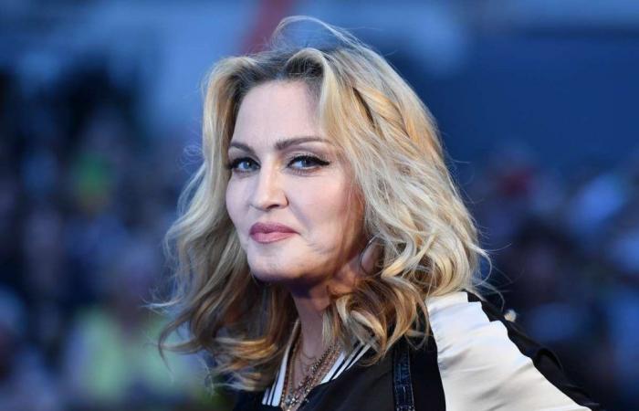 A fan in a wheelchair who Madonna had lifted at a concert reacts to the singer