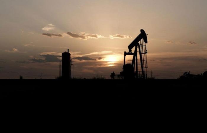 Oil rises as the dollar falls; focus shifts to economic data