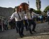 ‘Dancers of death’ carry coffins and defy the pain of goodbye in Peru